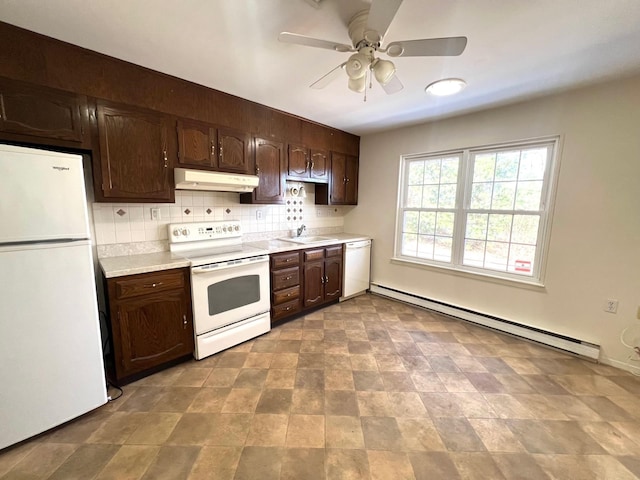 kitchen with dark brown cabinetry, sink, tasteful backsplash, baseboard heating, and white appliances