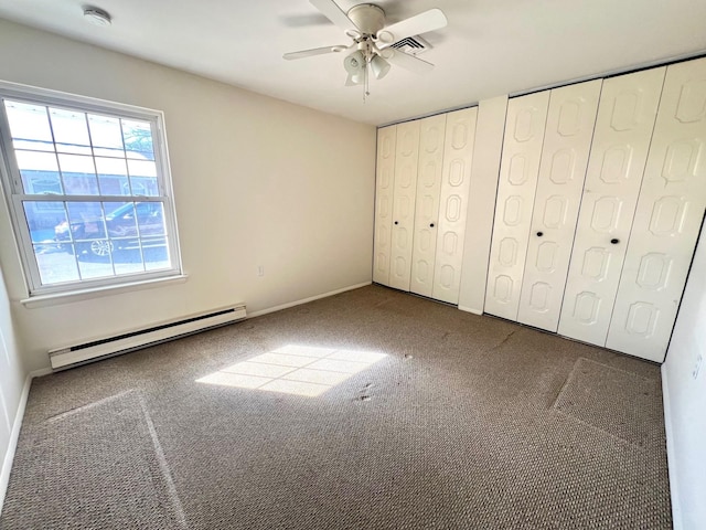 unfurnished bedroom featuring multiple closets, a baseboard radiator, carpet floors, and ceiling fan