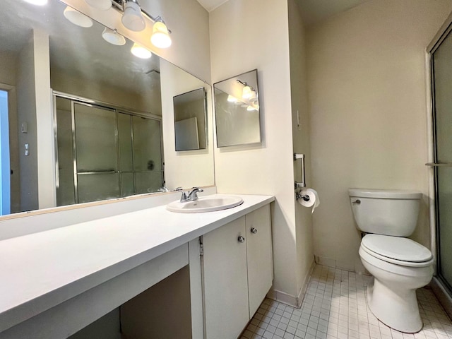 bathroom with vanity, an enclosed shower, tile patterned floors, and toilet