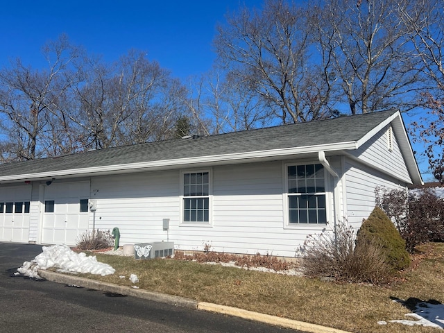 view of property exterior featuring a garage