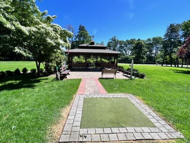 view of community with a gazebo and a lawn