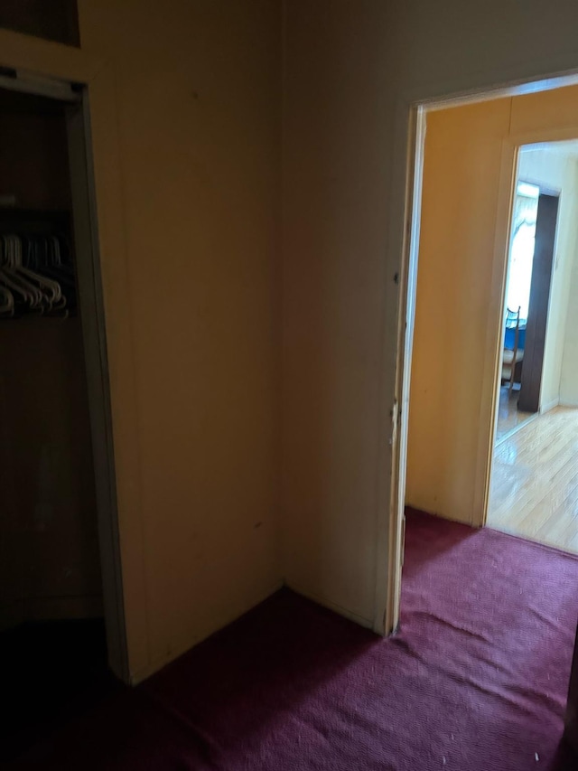 carpeted bedroom with a closet