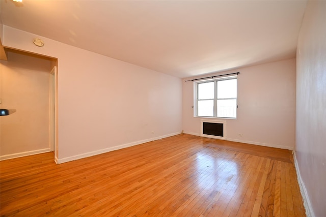 spare room featuring light hardwood / wood-style floors