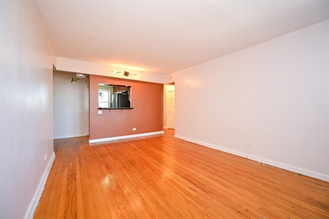 unfurnished room with light hardwood / wood-style floors