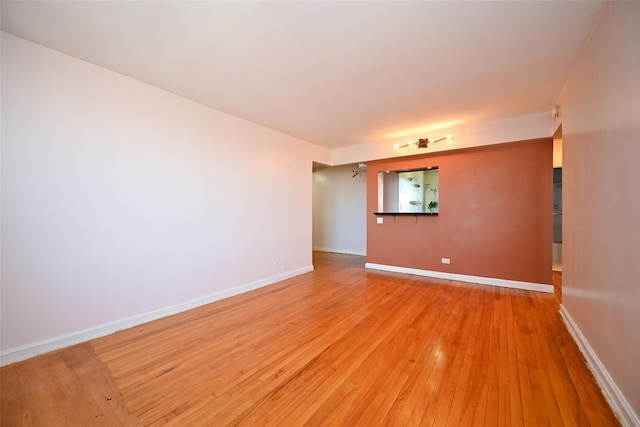 empty room featuring hardwood / wood-style flooring