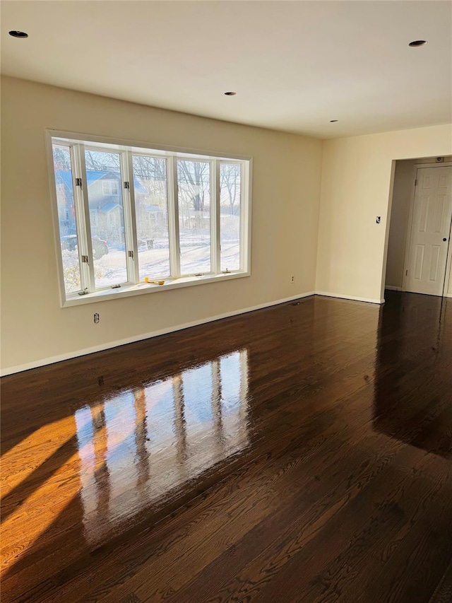 unfurnished room featuring dark hardwood / wood-style floors