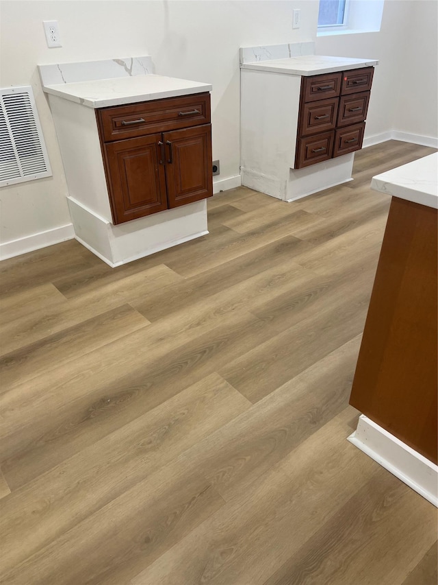 bathroom with wood-type flooring