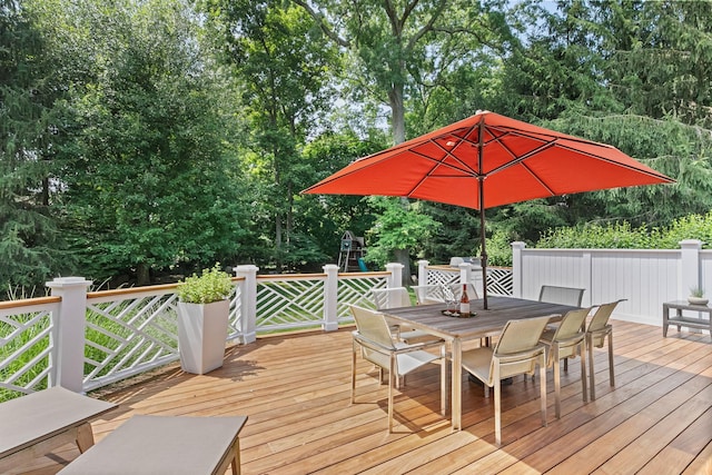 wooden terrace featuring outdoor dining space