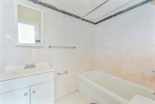 bathroom featuring tile walls, vanity, and tile patterned flooring