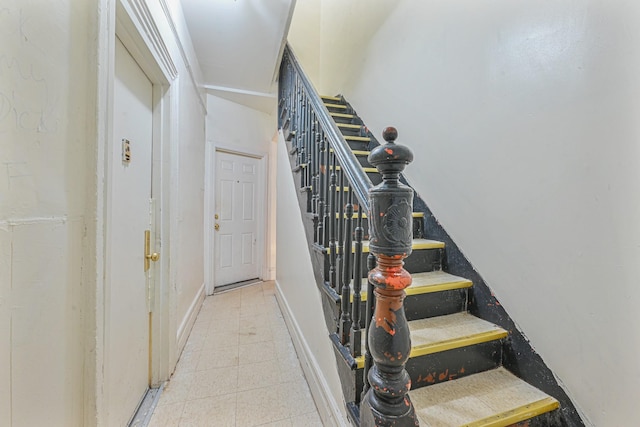 staircase with tile patterned flooring