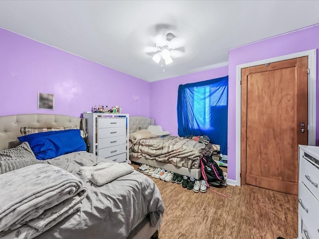 bedroom with ceiling fan and light wood-type flooring