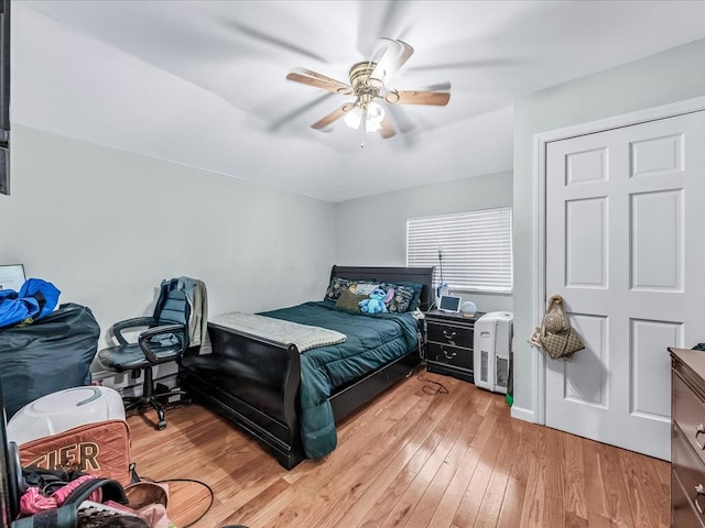 bedroom with ceiling fan and light wood-type flooring