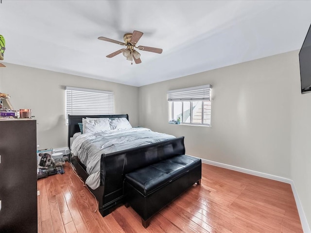 bedroom featuring hardwood / wood-style floors and ceiling fan