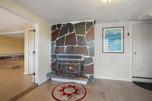 details featuring baseboard heating and a wood stove