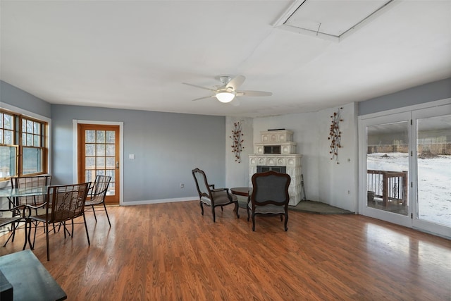 dining area with ceiling fan and dark hardwood / wood-style flooring