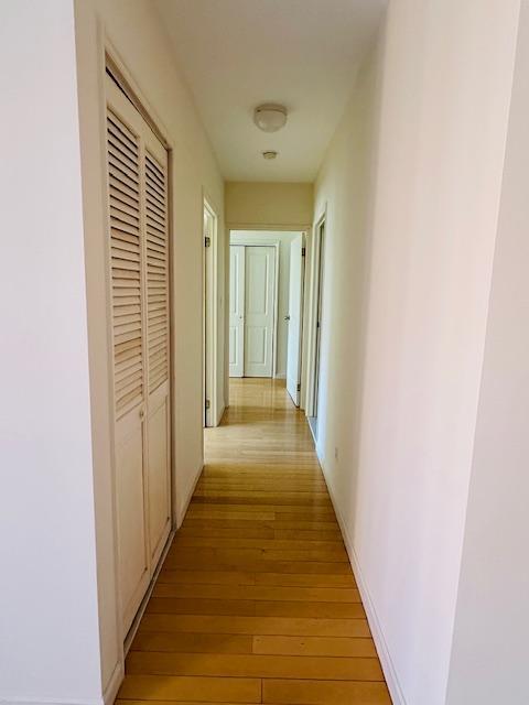 hall with light hardwood / wood-style floors