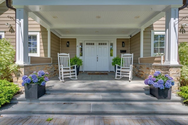 4 Clover Pl, New Rochelle, NY 10805 - property entrance featuring stone siding and covered porch