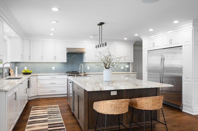 4 Clover Pl, New Rochelle, NY 10805 - kitchen featuring built in refrigerator, a sink, exhaust hood, white cabinets, and recessed lighting