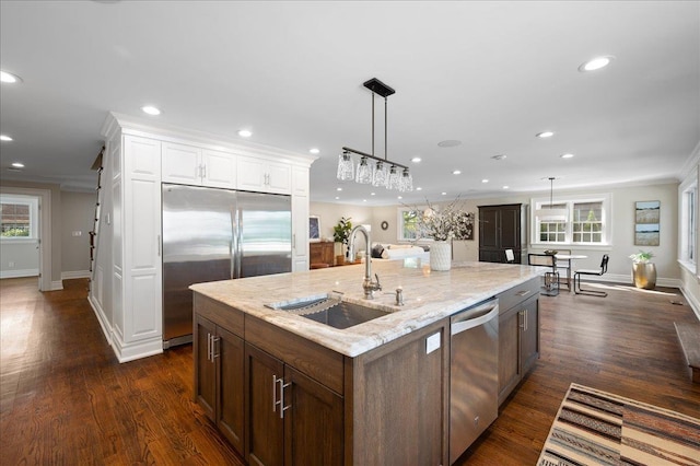 4 Clover Pl, New Rochelle, NY 10805 - kitchen with stainless steel appliances, a sink, recessed lighting, white cabinetry, and light stone countertops