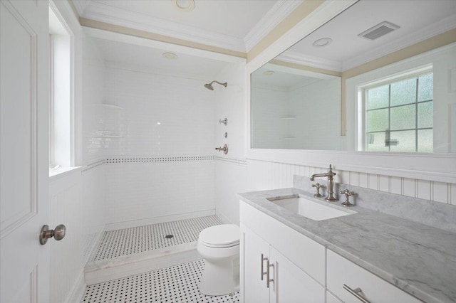 4 Clover Pl, New Rochelle, NY 10805 - full bathroom with tiled shower, vanity, toilet, ornamental molding, and a wainscoted wall
