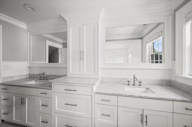 4 Clover Pl, New Rochelle, NY 10805 - bathroom featuring ornamental molding, vanity, and a wainscoted wall