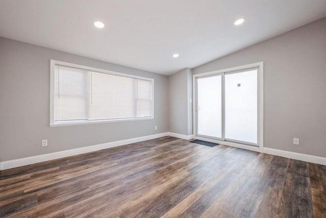 empty room featuring dark hardwood / wood-style flooring