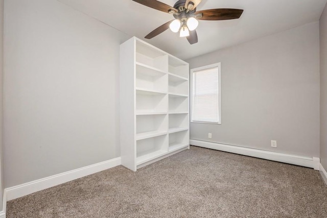 carpeted empty room featuring ceiling fan and a baseboard radiator