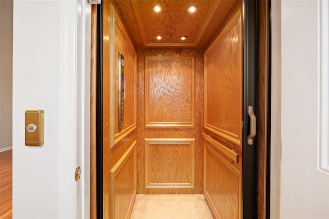 interior details with wood ceiling and elevator