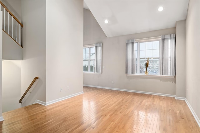 interior space with vaulted ceiling and light wood-type flooring