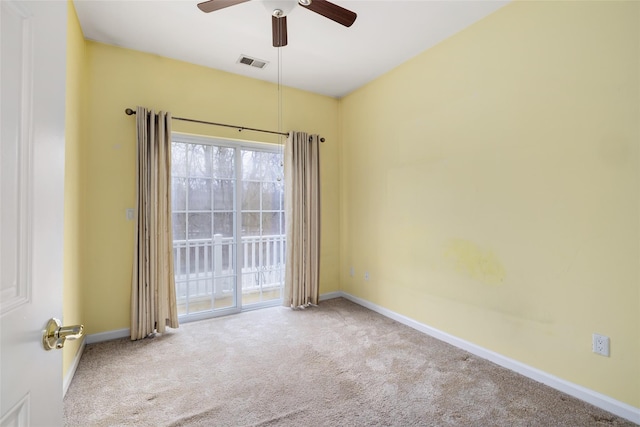 carpeted empty room featuring ceiling fan