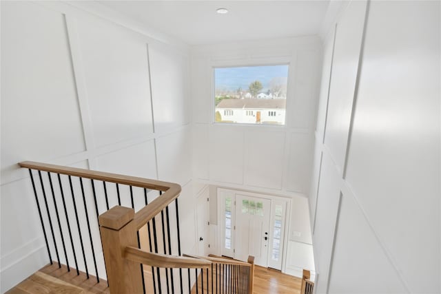 stairs with hardwood / wood-style flooring