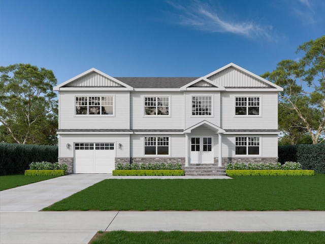 view of front of home featuring a garage and a front yard