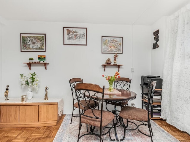 dining area with parquet floors