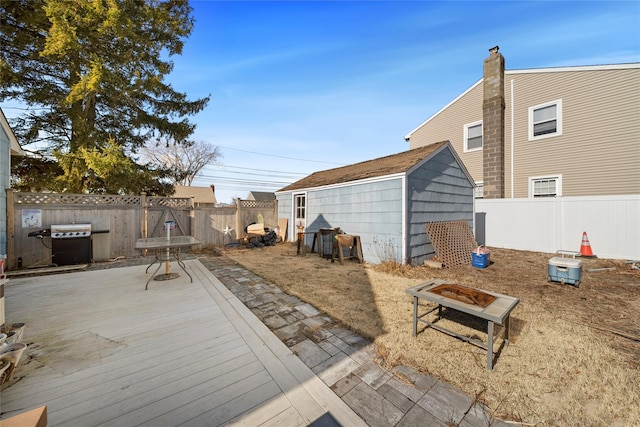 view of patio featuring a grill and an outdoor fire pit