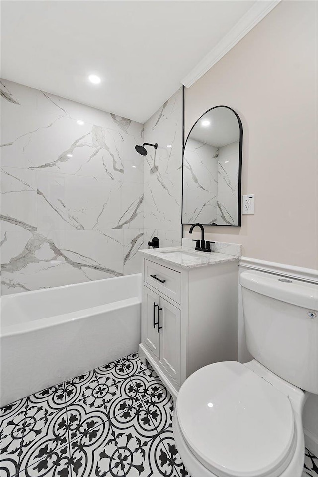 full bathroom featuring tiled shower / bath combo, vanity, ornamental molding, and toilet