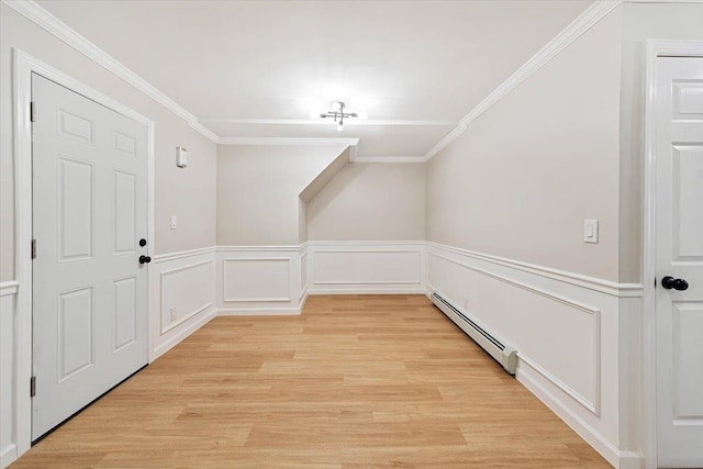 bonus room with light hardwood / wood-style floors and baseboard heating