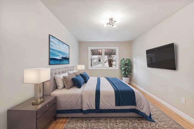 bedroom with light hardwood / wood-style flooring