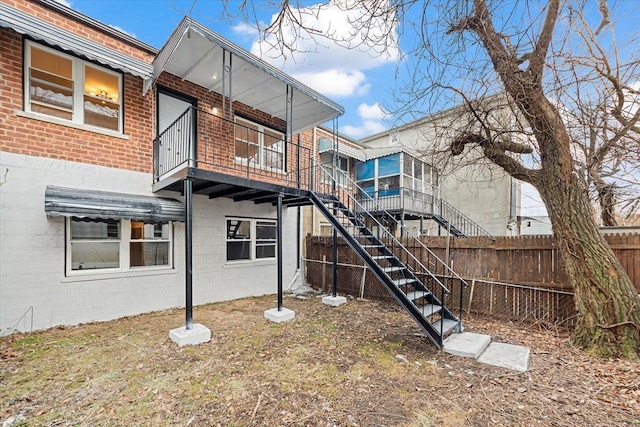 back of property featuring a balcony