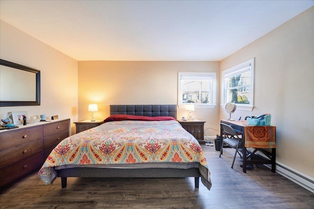 bedroom featuring hardwood / wood-style flooring and baseboard heating