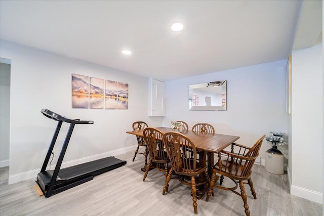 dining space with light hardwood / wood-style flooring