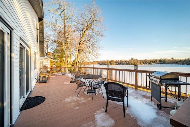 wooden deck featuring a grill