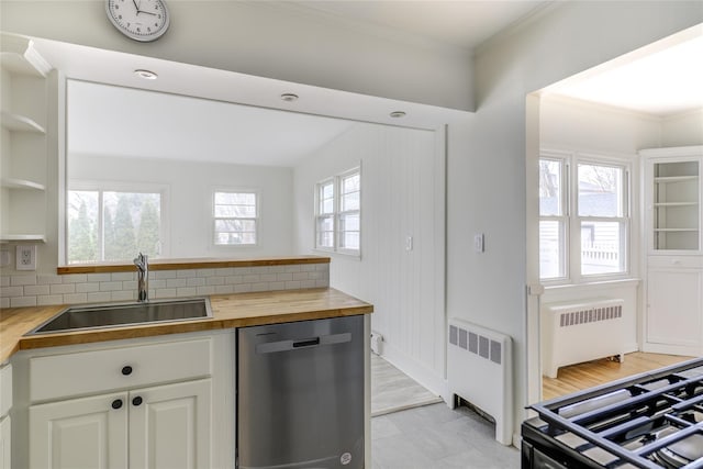 kitchen with white cabinets, radiator heating unit, wooden counters, and dishwasher