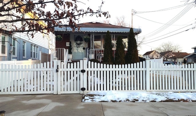 view of snow covered gate