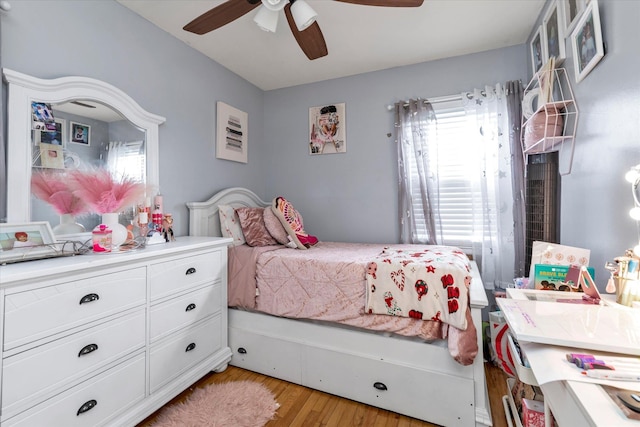 bedroom featuring light hardwood / wood-style flooring and ceiling fan