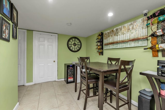 dining area with light tile patterned flooring and wine cooler