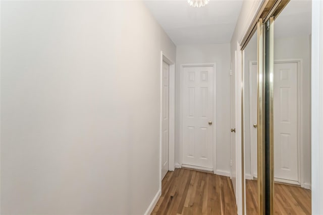 hallway with light wood-type flooring