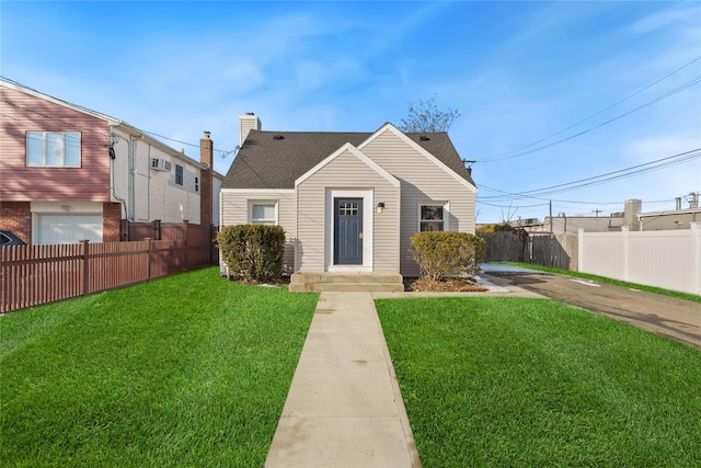 bungalow-style house featuring a front yard