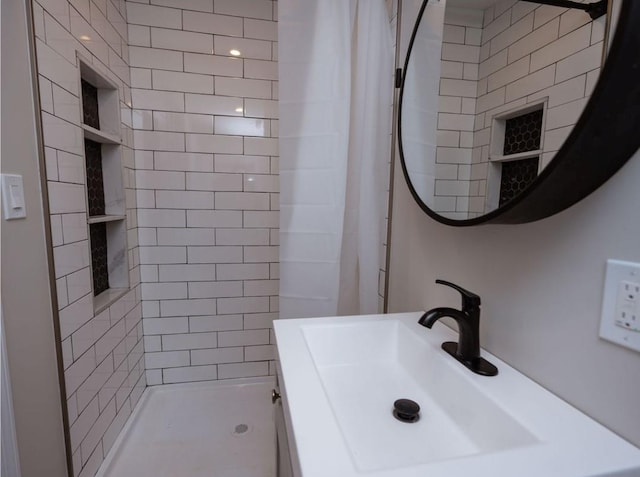 bathroom with sink and a shower with curtain