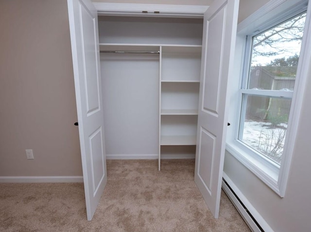 closet featuring baseboard heating