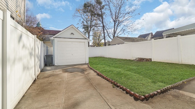 view of yard featuring a garage and an outdoor structure